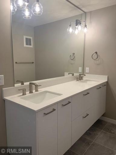 Photo for 16060 Eagleview Drive, Lakeville, MN 55044 - Listing #6434031 Double bowl with sinks floating vanity. Notice the lights are in the mirror - attention to details!