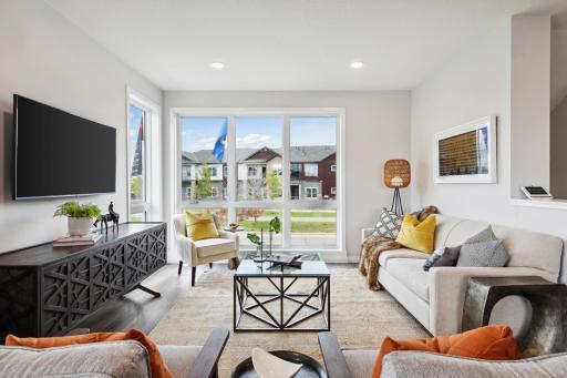 Photo for 16060 Eagleview Drive, Lakeville, MN 55044 - Listing #6434031 Model inspiration photo. The floor to ceiling windows are a "statement piece" to the main level. Urban styled interiors with luxury features. Photo is of similar floorplan; options and features will vary.