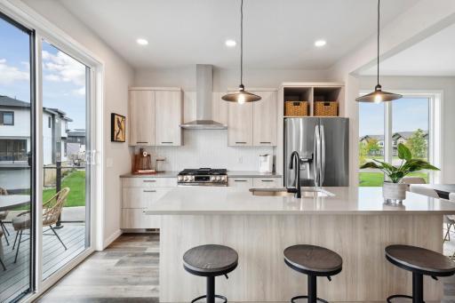 Photo for 16060 Eagleview Drive, Lakeville, MN 55044 - Listing #6434031 Model inspiration photo. 3cm quartz counter tops and Prism custom cabinets put the finishing touch on this beautiful kitchen. Urban styled interiors with luxury features. Photo is of similar floorplan; options and features will vary.
