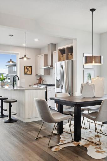Photo for 16060 Eagleview Drive, Lakeville, MN 55044 - Listing #6434031 Model inspiration photo. The open flow of the main level is perfect for every occasion. Urban styled interiors with luxury features. Photo is of similar floorplan; options and features will vary.