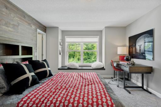 Roomy dimensions for a desk, dressers and a sizeable bed.