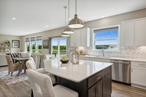 Big kitchen window brightens the kitchen while bringing in the beautiful outside views.