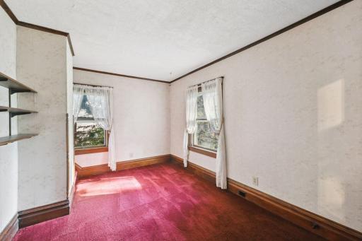 Bedroom #3 on the upper level. This room also has the walk-up stair access to the huge unfinished attic.