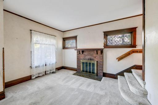 The wood burning fireplace in the living room.