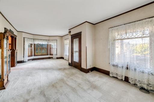 The living room is spacious and provides plenty of space for relaxing or entertaining. There are wood floors under all of the carpeted areas per the family.