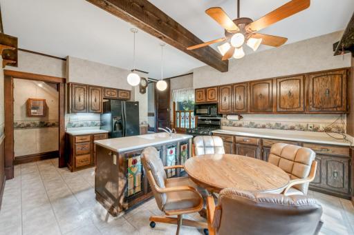 The kitchen is very spacious and has ample countertop workspace and storage. It is set up as an eat-in kitchen for casual dining, but there is also a separate, formal dining area as well.