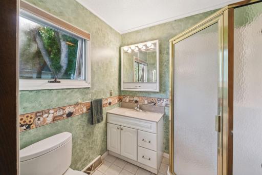 The 3/4 bathroom is on the main floor. There is also a 1/4 bathroom in the basement.