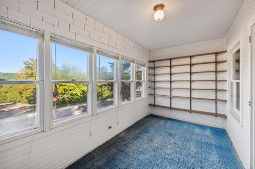 This front porch area off of the main bedroom is the perfect spot to relax and enjoy a book and a nice cup of coffee.