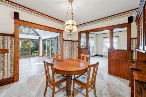 The formal dining area is open to the living room and the beautiful sunroom which allows for easy space to extend dining options for large gatherings.