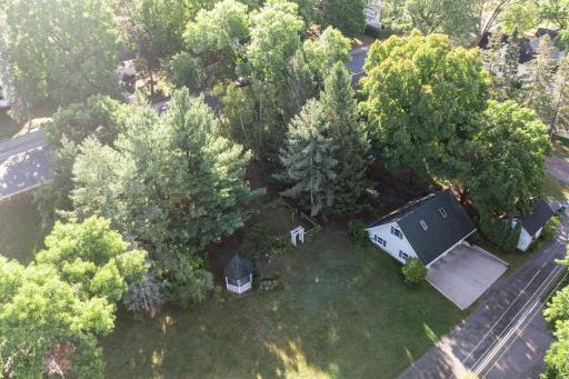 An aerial view of the back lot (triple wide 150' lot). There is a huge lawn space that would be perfect for outdoor activities, gardening, or surface storage for additional vehicles or trailers. This lot goes all the way up to Adams Street.