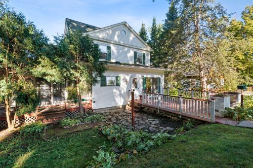 A closer view of the back of home and deck area.