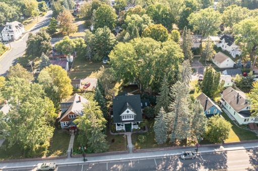 A front view that shows the home on the main double lot with a view to the back lot with the gazebo located in the center of the lot.