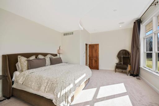The primary bedroom is spacious, bright, and private.