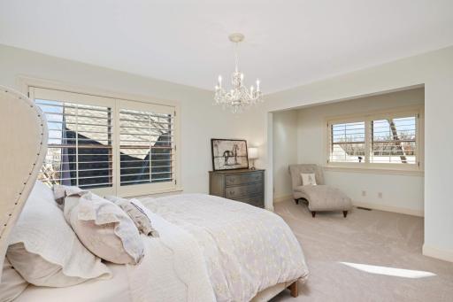 One of two upper level bedrooms with an alcove.