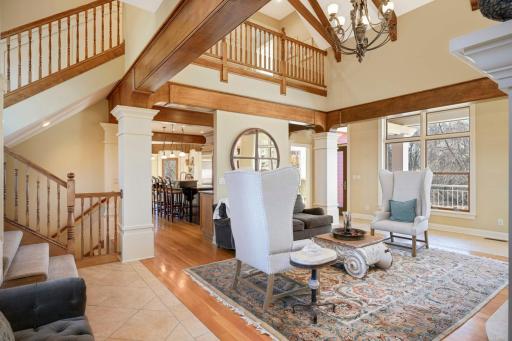 The living room features a vaulted ceiling.