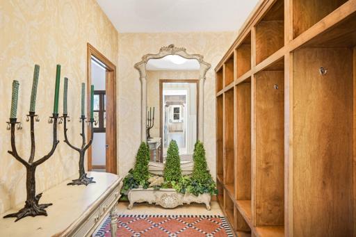 The mudroom, with custom "lockers", is conveniently located near the laundry room to the left.