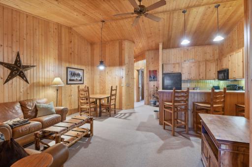 The stable apartment features a full kitchen, two bedrooms, one bathroom, and a large living area