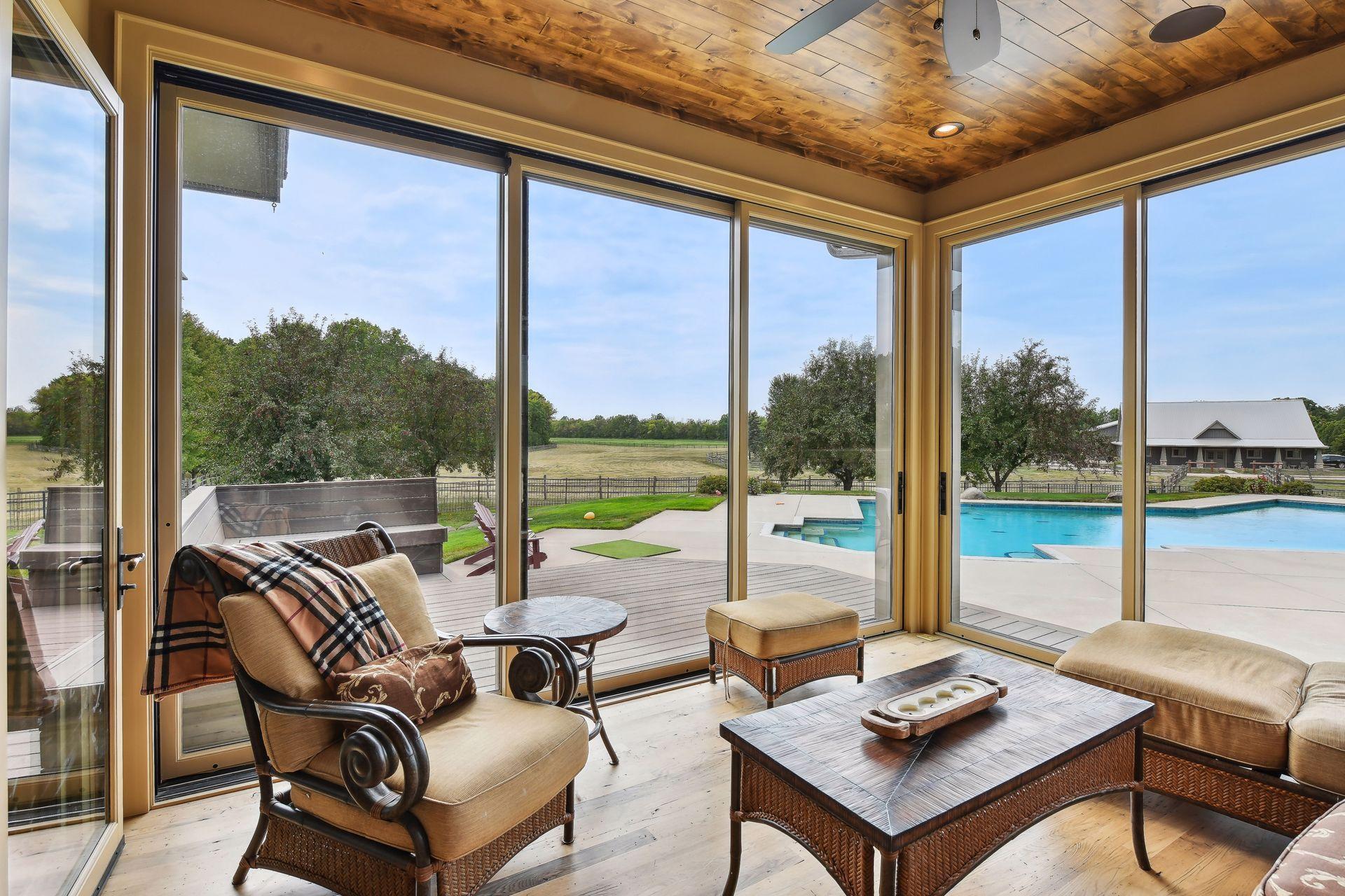 Newer 4 season porch overlooks the entire property and pool area.