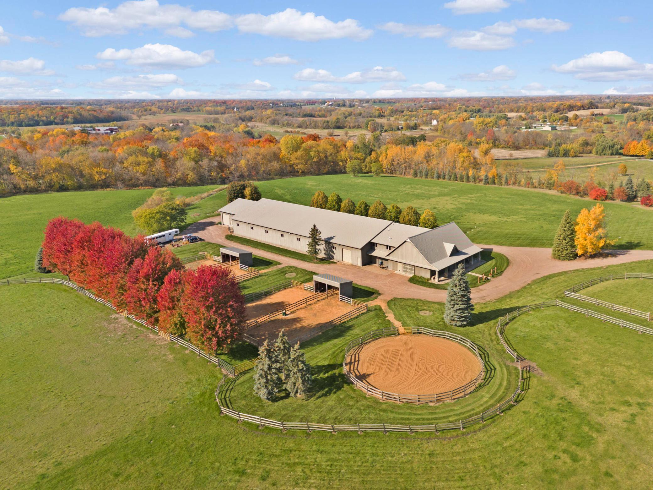 Custom built 20,000 sqft. outbuilding with paddocks, sheds, and riding ring