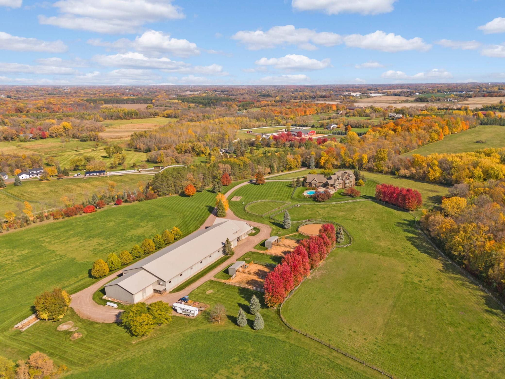 Aerial view looking northeast of equestrian facilities, house and pasture