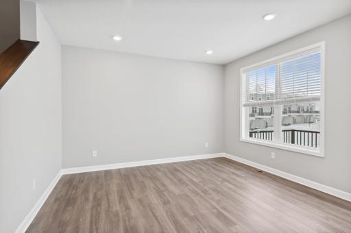 Another view of the extension from the kitchen with a double window overlooking the private deck. (Photo of a completed home, actual home's finishes may vary slightly)