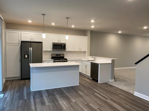 Beautiful kitchen with large center island and a breakfast bar.