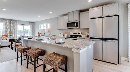 Spacious island with enough seating for 3-4 people. Model picture shown. Colors and finishes may vary