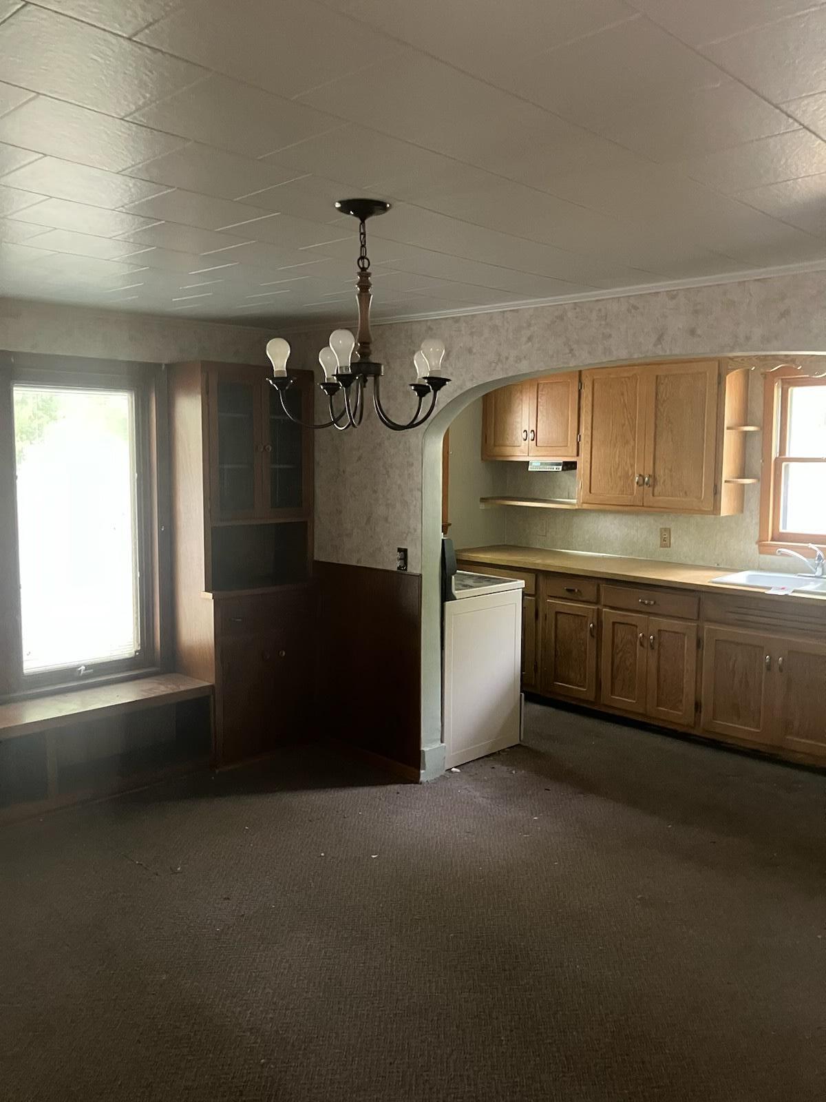 The dining room is furnished with gorgeous wood built-in cabinets.