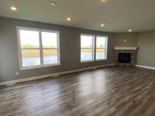 Notice the stunning natural light pouring into this spacious Great Room. (Photo of completed home, actual home finishes may vary slightly)