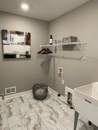 The laundry room is conveniently located upstairs.