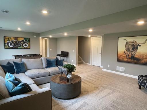 This finished basement also has a bedroom, bathroom, and a room for extra storage.