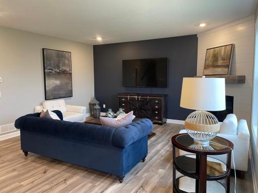 Imagine coming home from a long day and relaxing in this cozy living room.