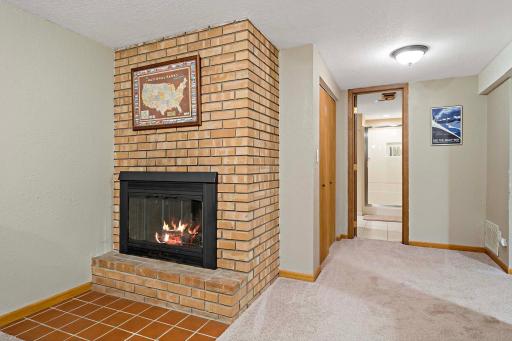 Beautiful brick fireplace in the lower level.