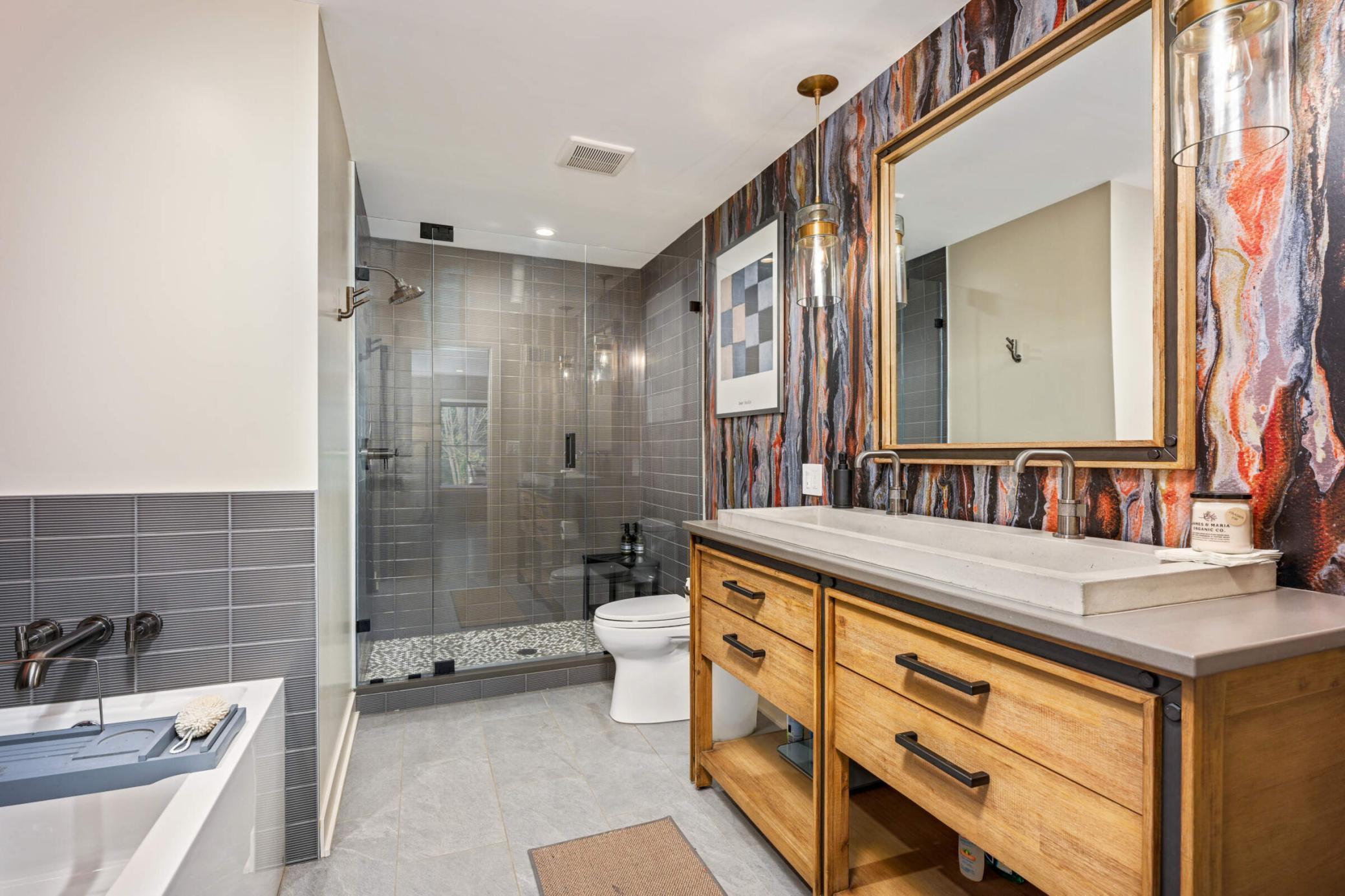 Ground level main bathroom with separate tube and walk-in shower. Very convenient for a future swimming pool...