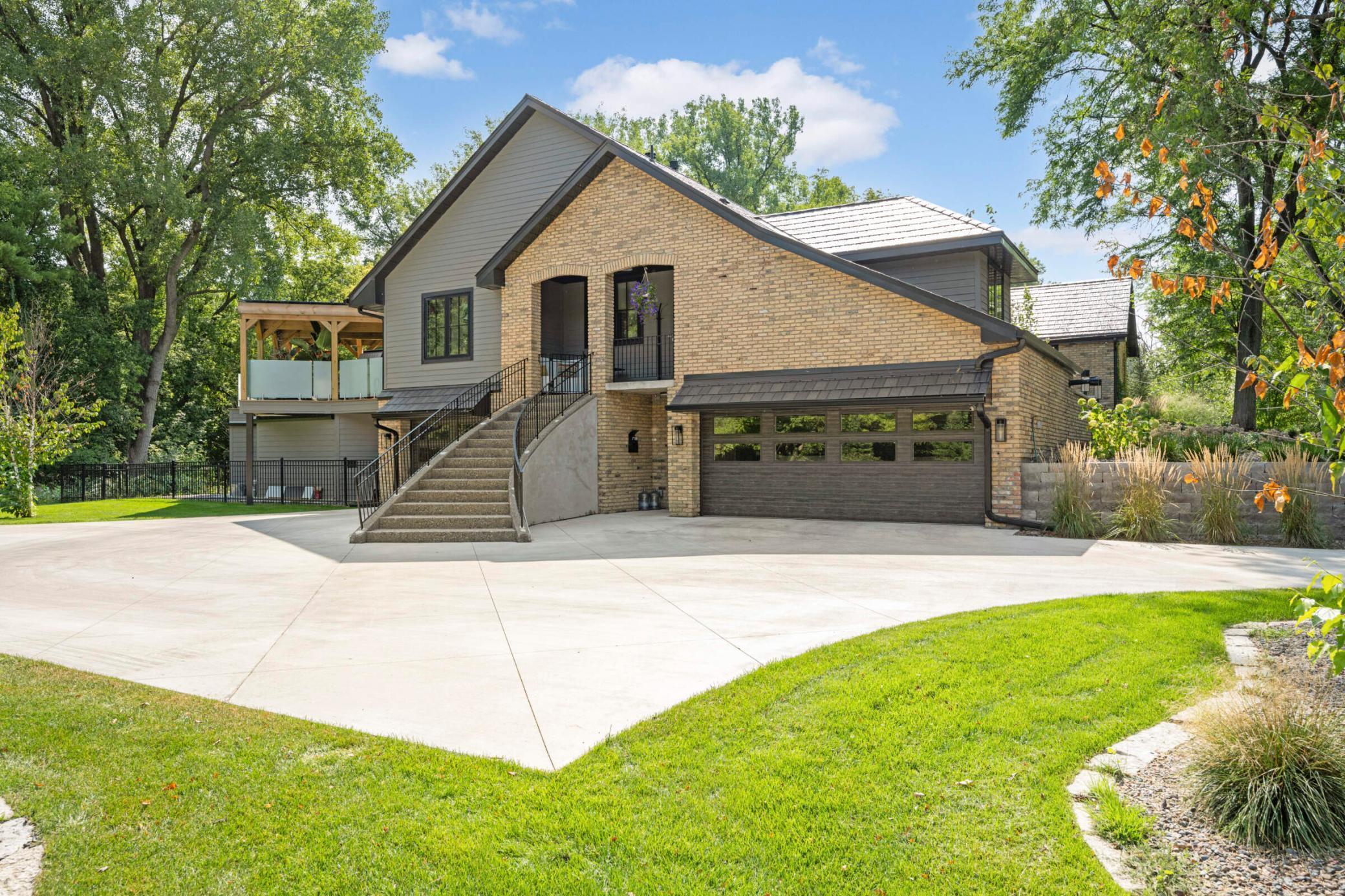 Heated oversized three-car garage with additional storage for two-wheel toys and ample guest parking