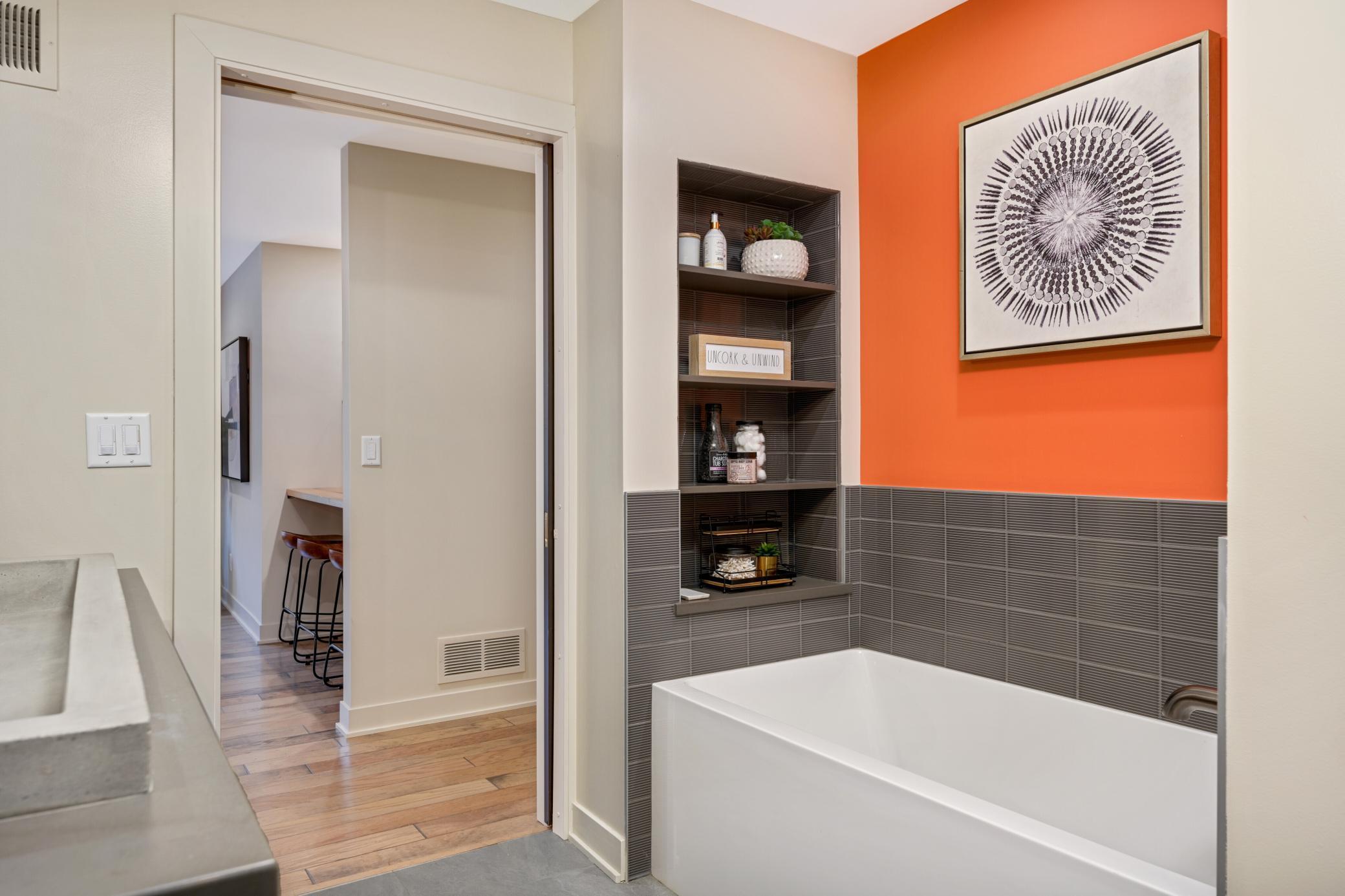 Ground level main bathroom with separate tub and shower