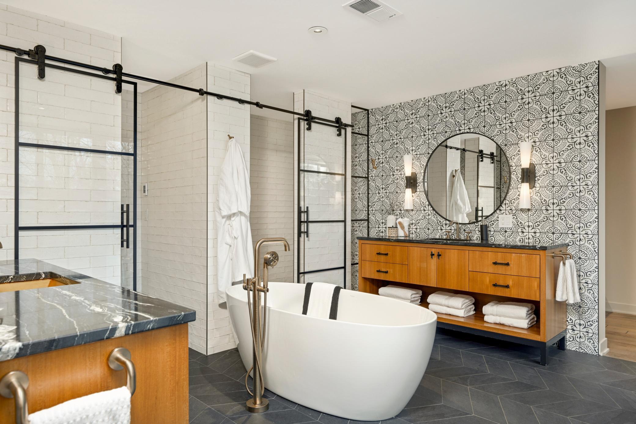 Spa like ensuite bathroom with heated floor, his and hers vanities