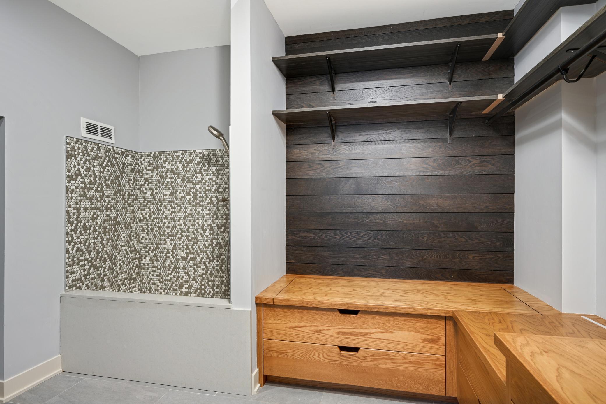 Mud room with built-ins, doggy bathroom / wash station and tech tower
