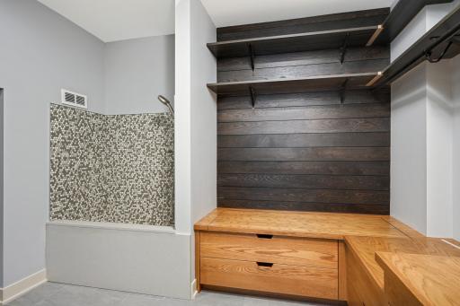 Mud room with built-ins, doggy bathroom / wash station and tech tower