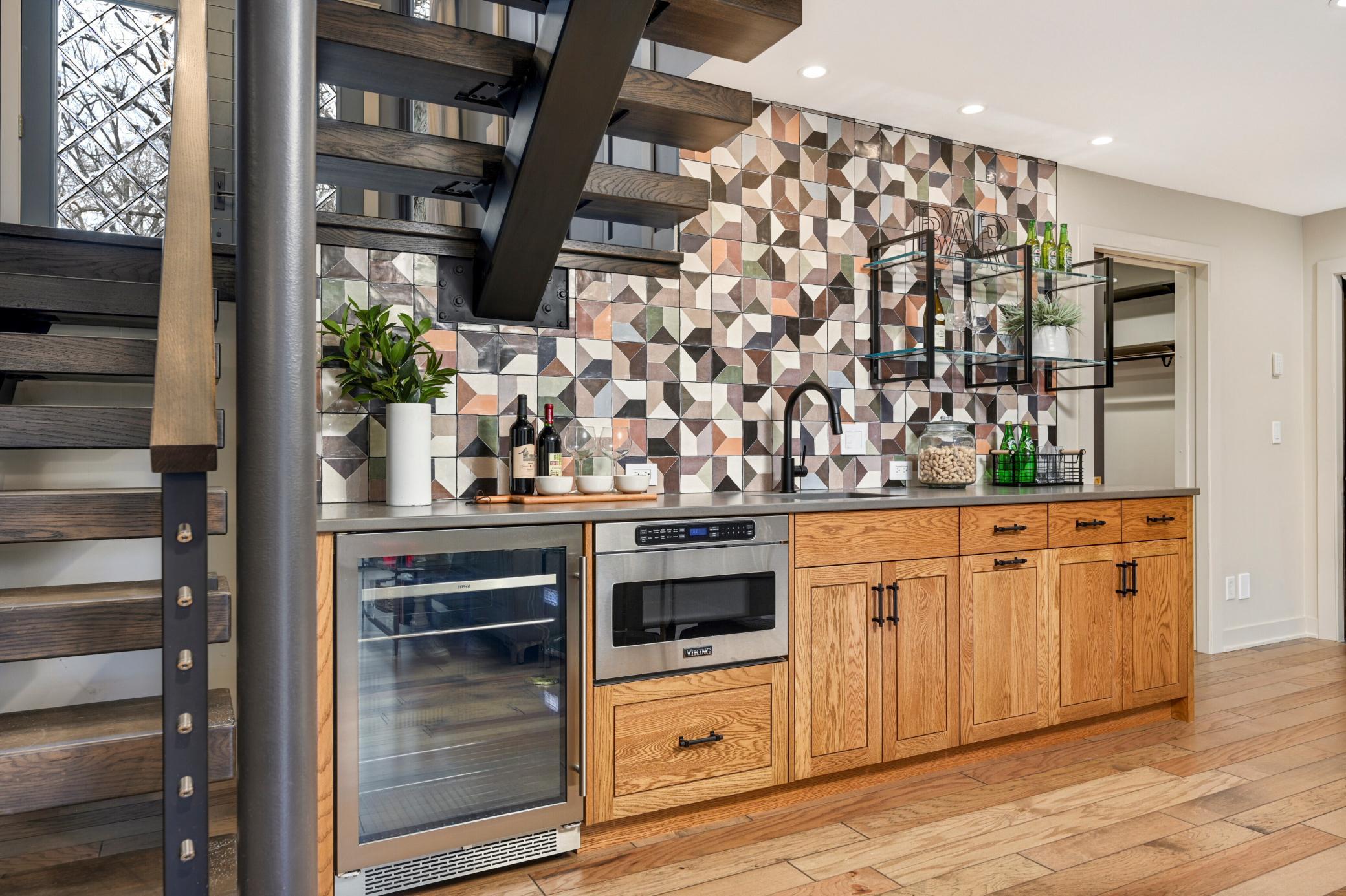 Ground floor wet bar with built-in microwave for movie-night snacks