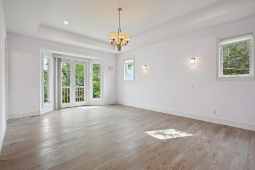 Main floor Primary Suite with french doors