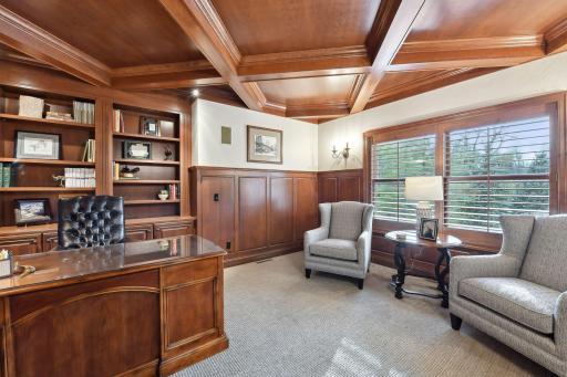 Main floor den with coffered ceilings.