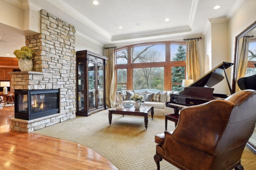 Double sided gas burning fireplace from living room to eat-in kitchen