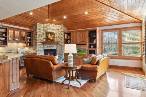 Siting room off of kitchen with gas burning fireplace