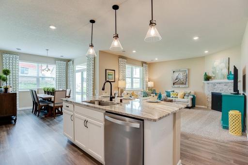 The home flow has the perfect balance of open concept with defined spaces for your kitchen, dining and living room needs.