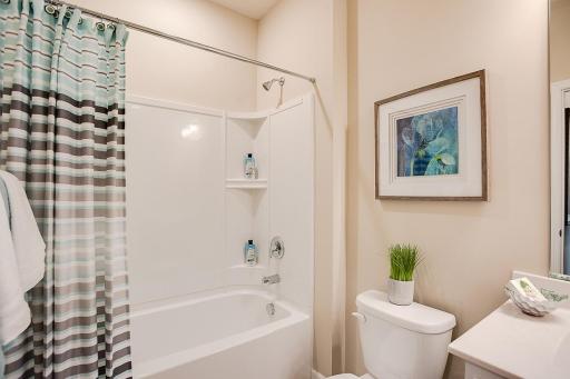 Full bathroom in the front of the home includes tub and shower.