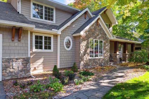Charming pathway and landscaping add to the curb appeal of this lovely home