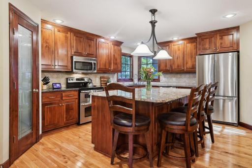 The open kitchen offers a large center island, ideal for meal prep or grabbing a quick bite to eat