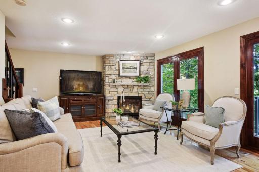 A cozy gas fireplace anchors the far end of the living room