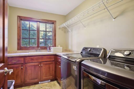 South-facing windows fill the main level laundry with natural light